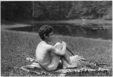 frederick-holland-Nude_youth_with_pipe_seated_on_leopard_skin,_in_nature